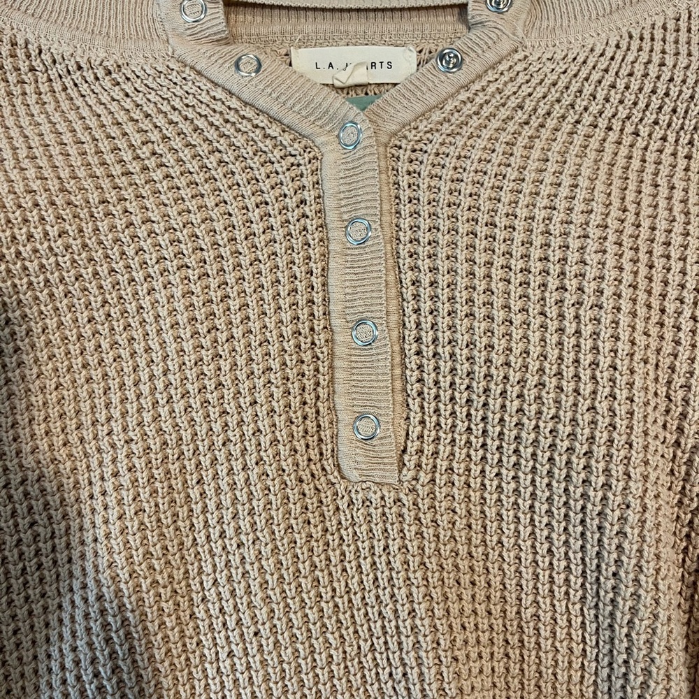 Knitted button sweater, light pinkish cream color, size medium.